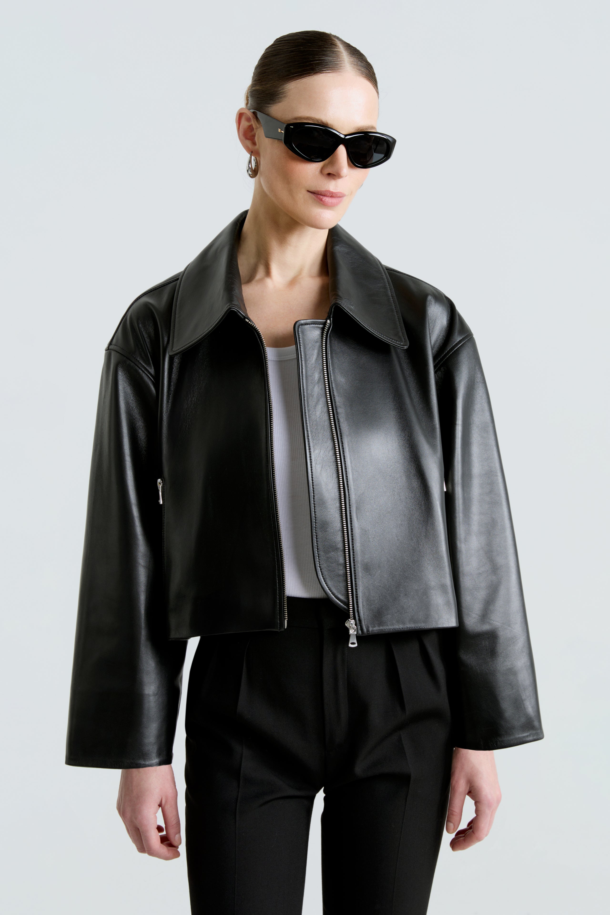 Model is wearing the Sloan Black Minimalist Leather Jacket Close Up