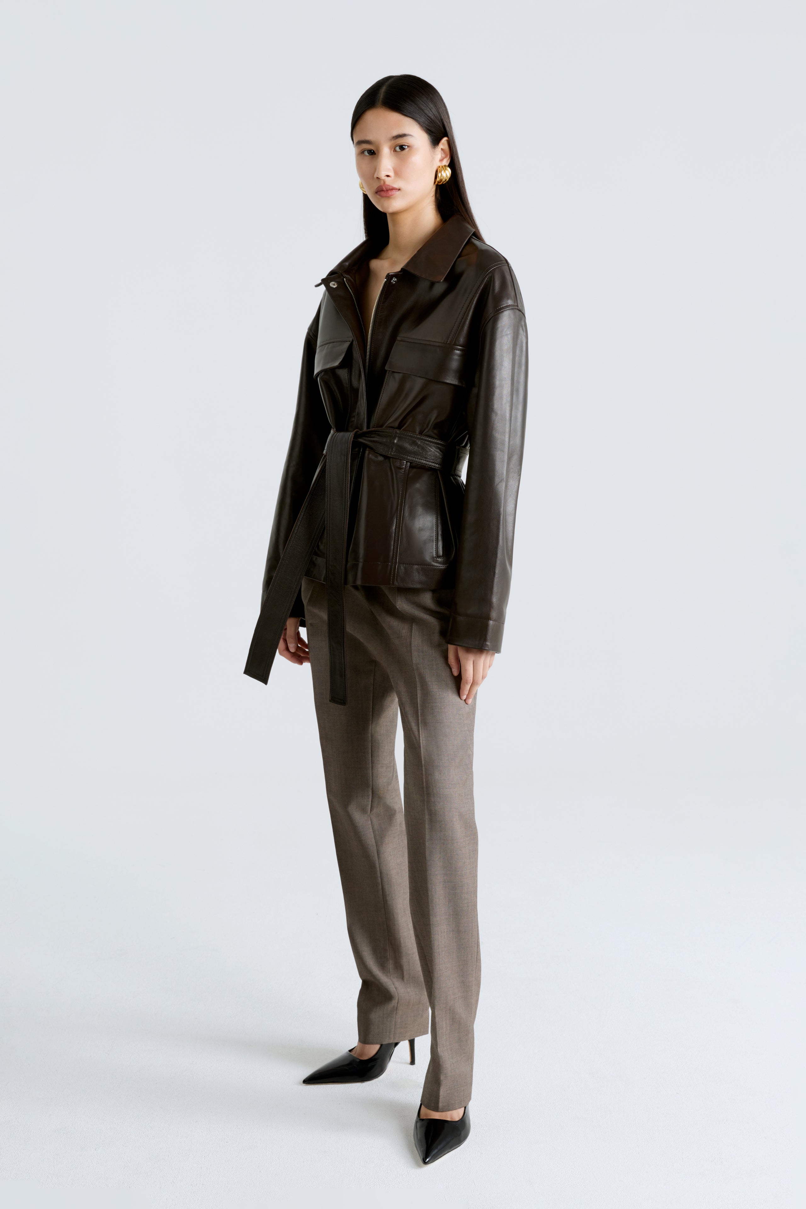Model is wearing the Tilda Syrup Belted Leather Jacket Side