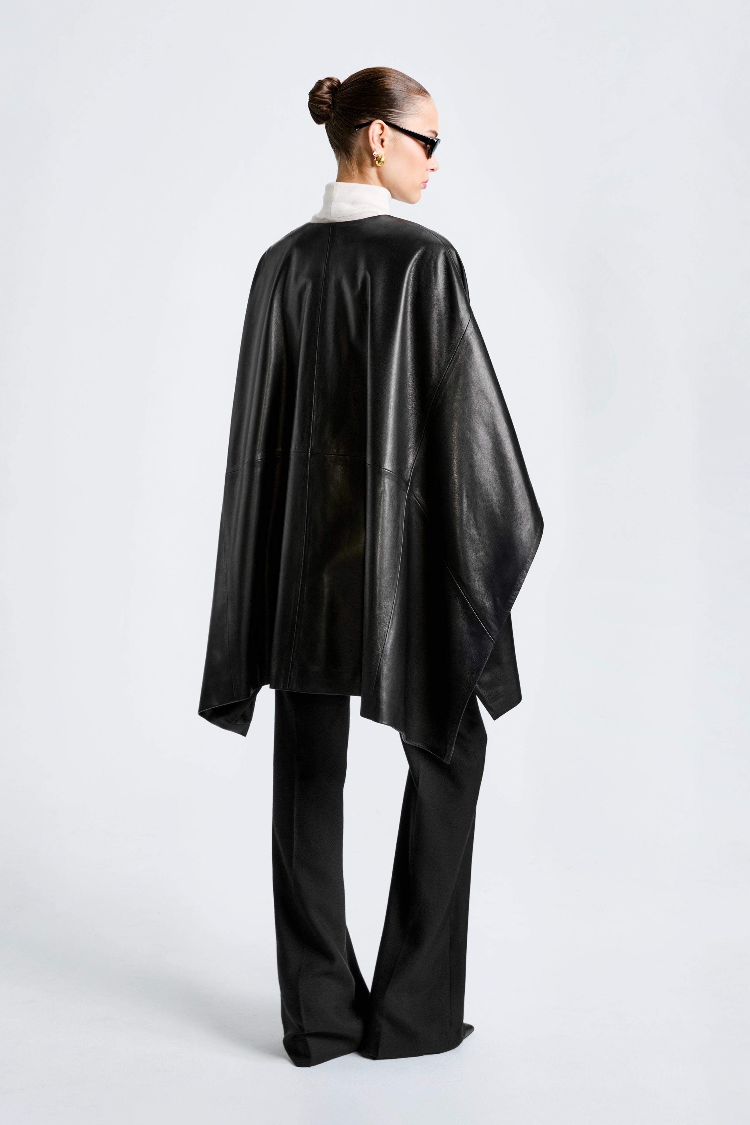 Model is wearing the Nour Hammour Vera Black - Luxurious Leather Cape - Back