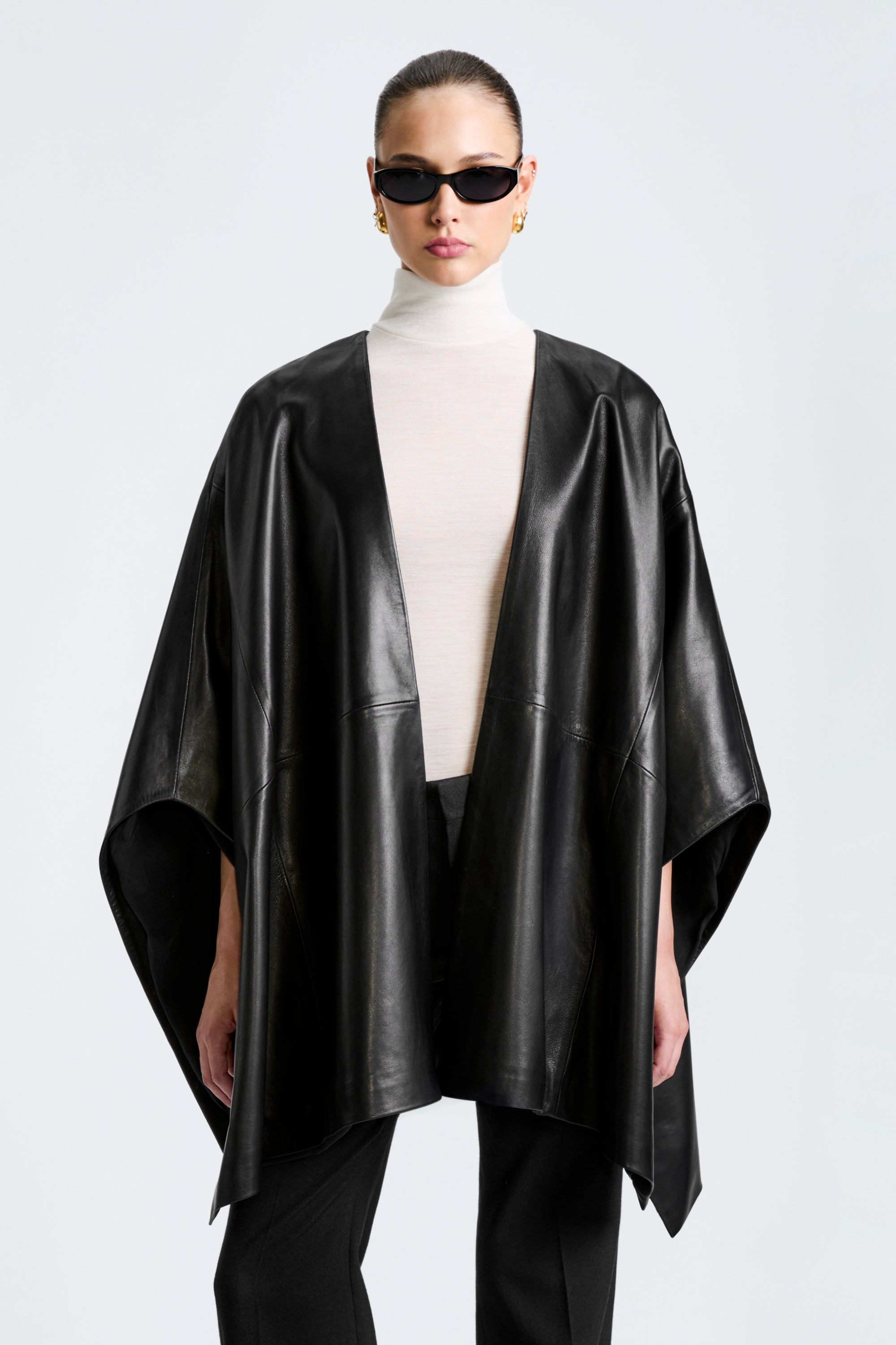 Model is wearing the Nour Hammour Vera Black - Luxurious Leather Cape - Close Up