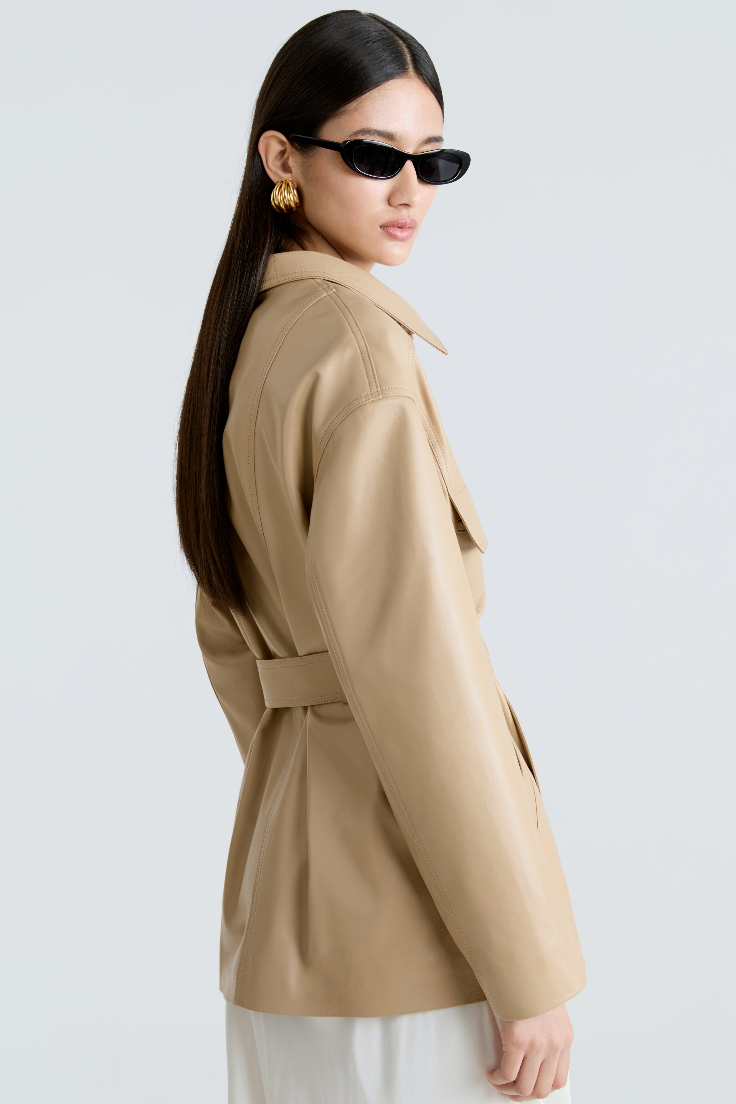 Model is wearing the Zakary Beige Belted Leather Jacket Side