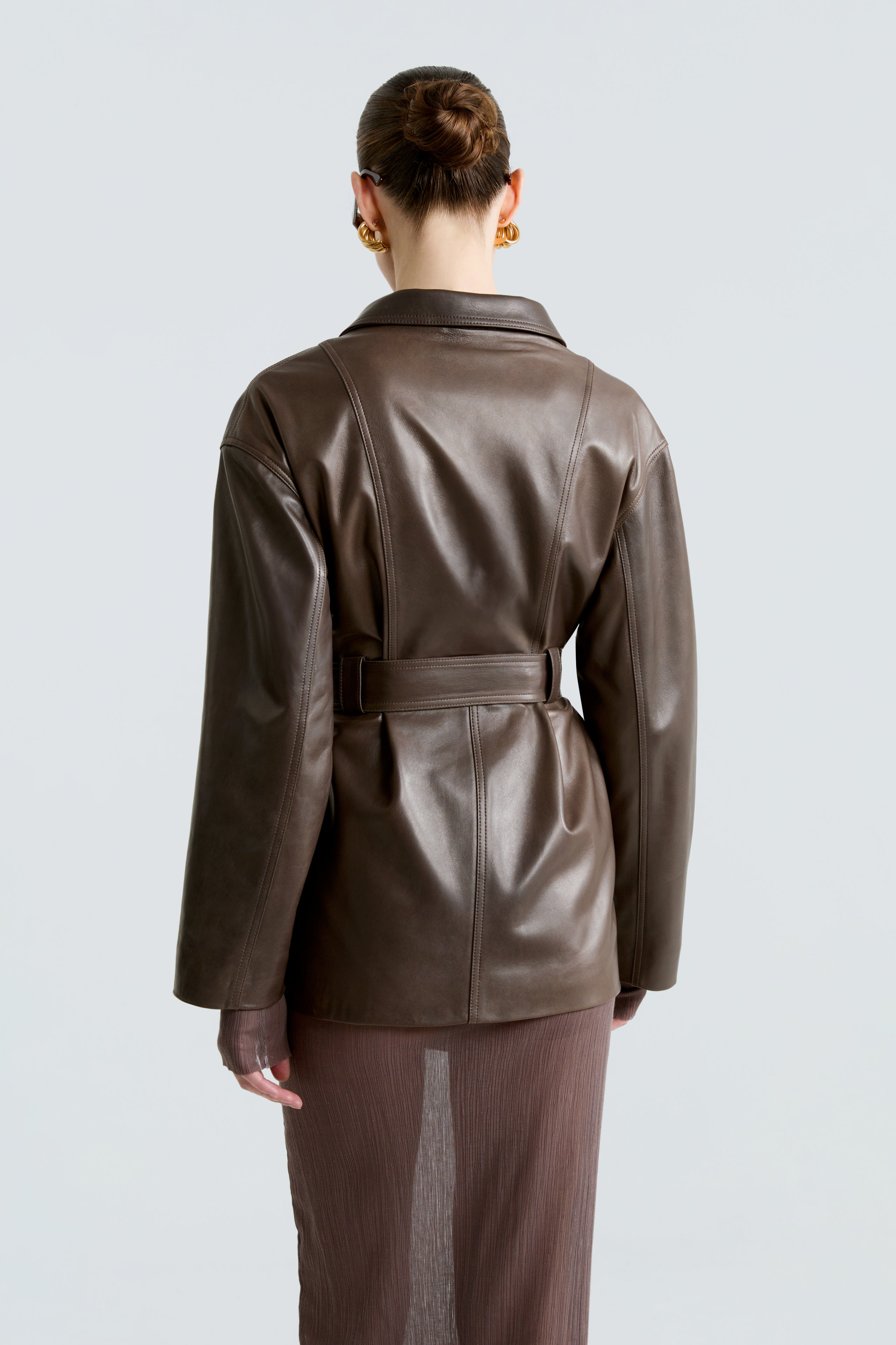 Model is wearing The Nour Hammour Zakary Truffle Belted Leather Jacket Back