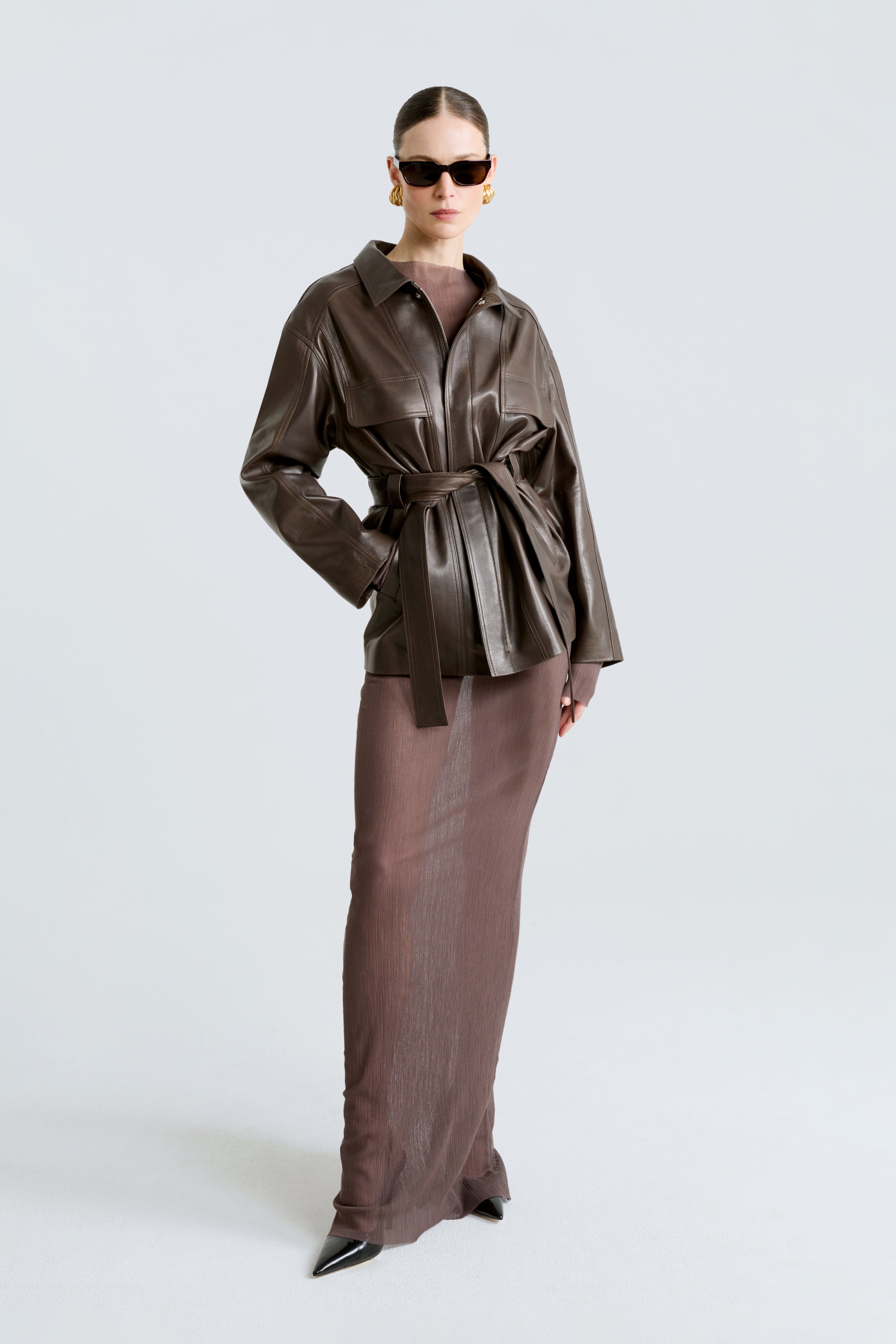 Model is wearing The Nour Hammour Zakary Truffle Belted Leather Jacket Front