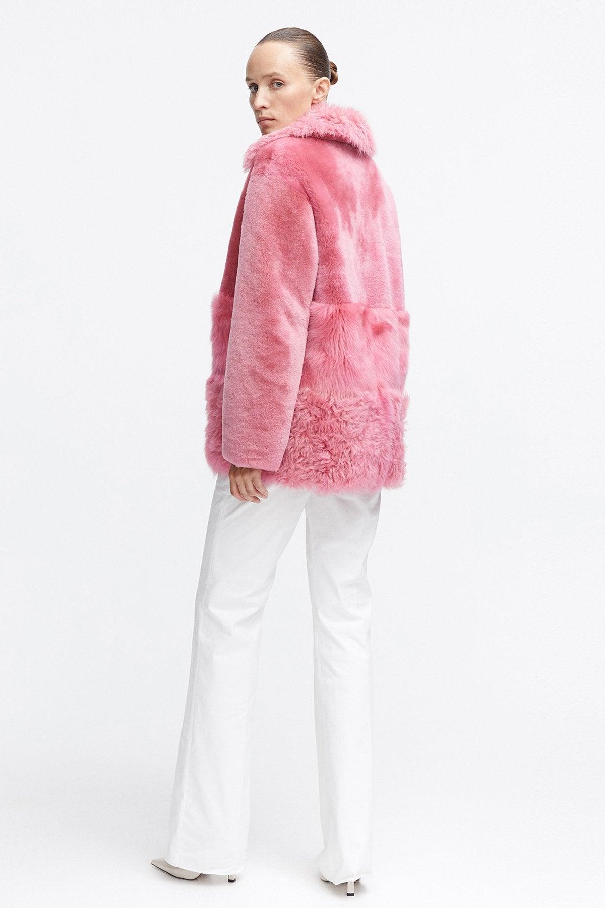 Model is wearing the Anouk Taffy Pink Luxurious Shearling Coat Back