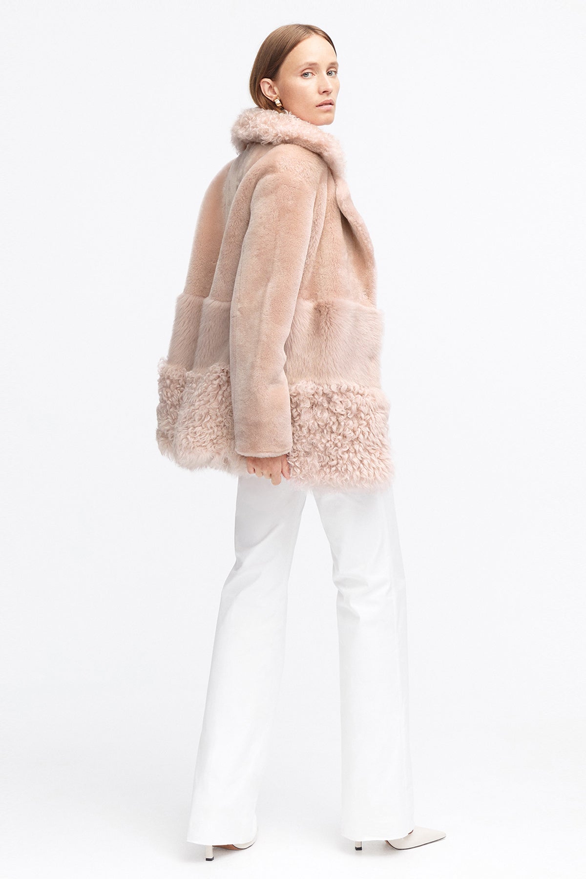 Model is wearing the Anouk Nude Luxurious Shearling Coat Side