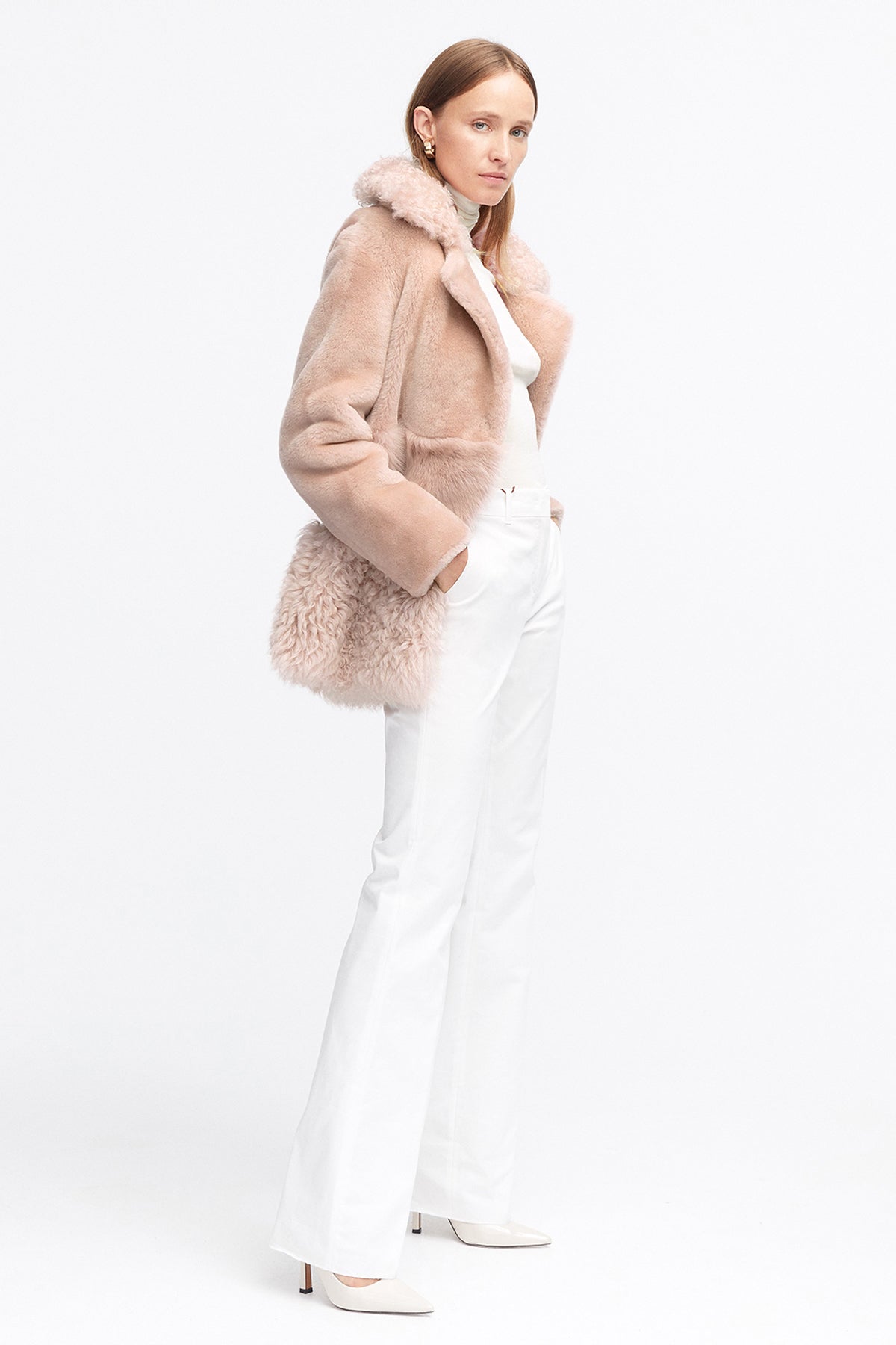 Model is wearing the Anouk Nude Luxurious Shearling Coat Side
