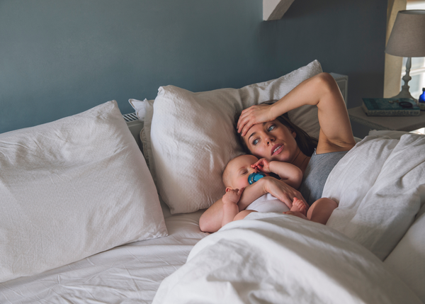 Sleep deprived mum with baby