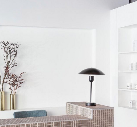 spa desk clean and simple with tiles and white wall