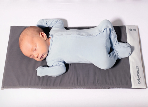 A baby sleeping on Baby Brezza Tranquilo Smart Soothing Baby Mat with Bluetooth -ANB Baby