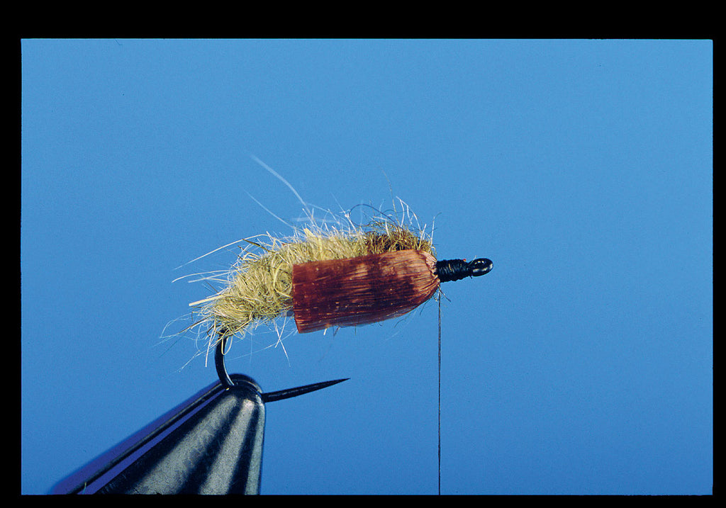 When the far is wing formed, pinch both wings against the sides of the thorax, and secure both film tags with tight thread wraps. Clip and bind down the excess. The fly can be finished with a thread head, or other components added.