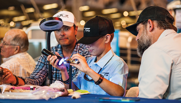 Braden tying a craft fur minnow at Lefty Kreh’s Celebration of Life in 2018 while Temple Fork Outfitters Advisory Staff Member, Blane Chocklett, and fellow TFO Ambassador, Chris Thompson watch.