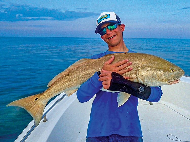 Braden fishing with friend and TFO Ambassador, Andrew Campbell (Captain of Flying Fish Charters) Braden caught his first bull redfish off Harker’s Island, NC. A fractured wrist and growth plate couldn’t stop him from tying flies and fishing