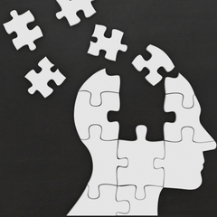 A graphic of a puzzle shaped like a mans head with a piece flying out from the back of head