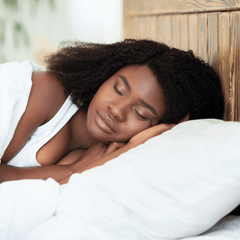 A woman sleeping peacefully in bed
