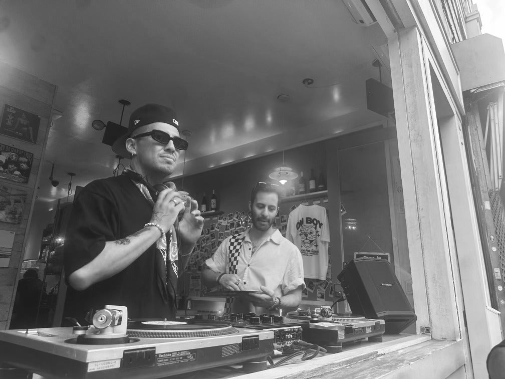 Julio DJing at an event in black and white