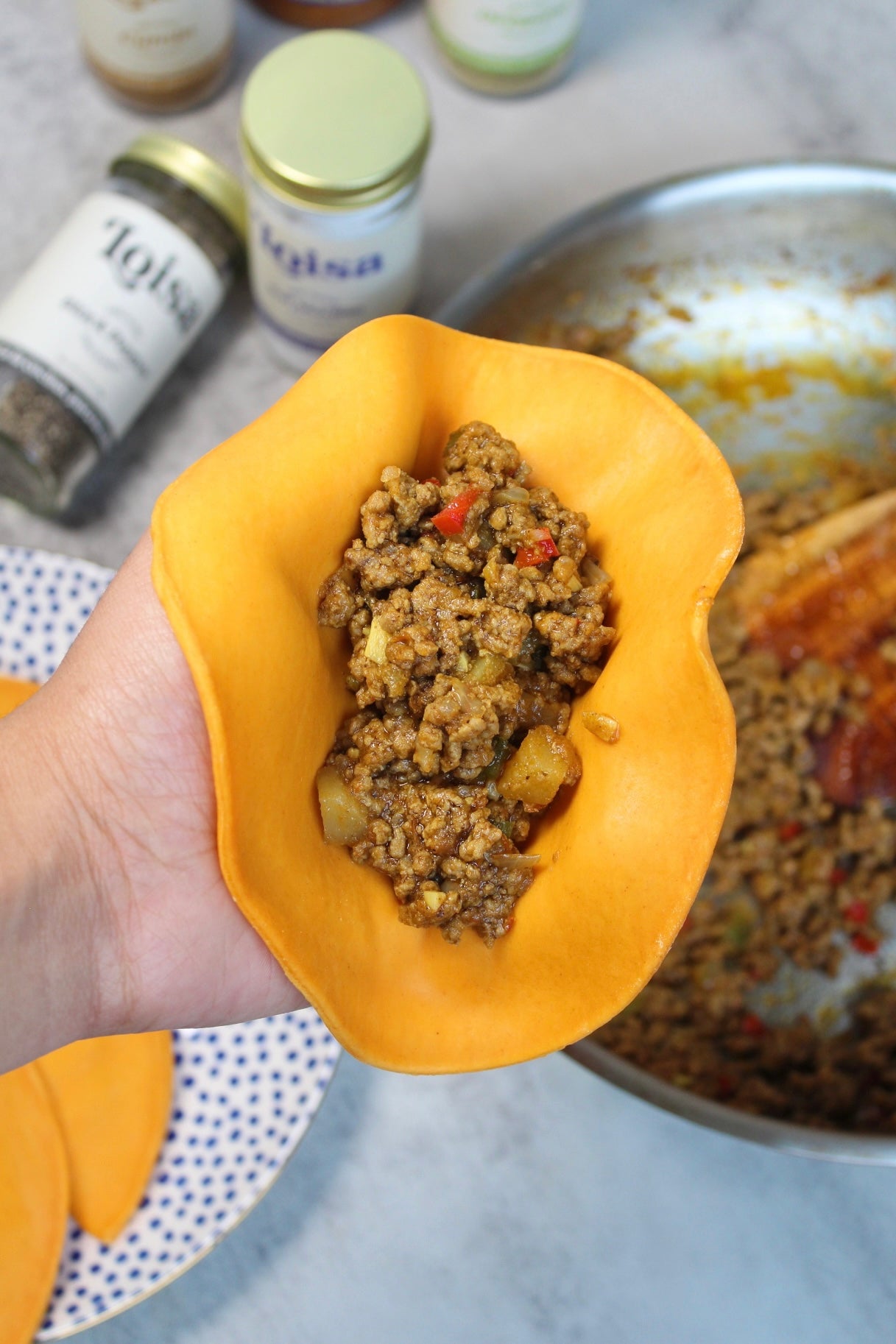 Assembling empanadas with filling