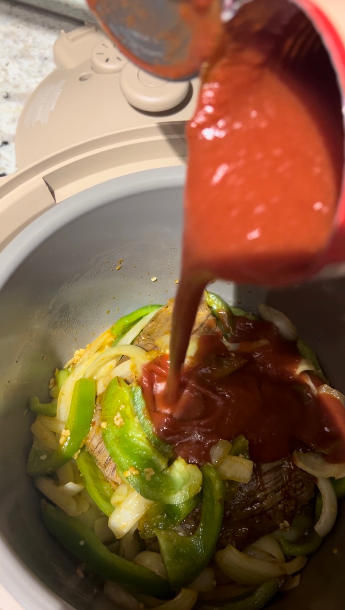 Pour tomato sauce onto ropa vieja before slow cooking