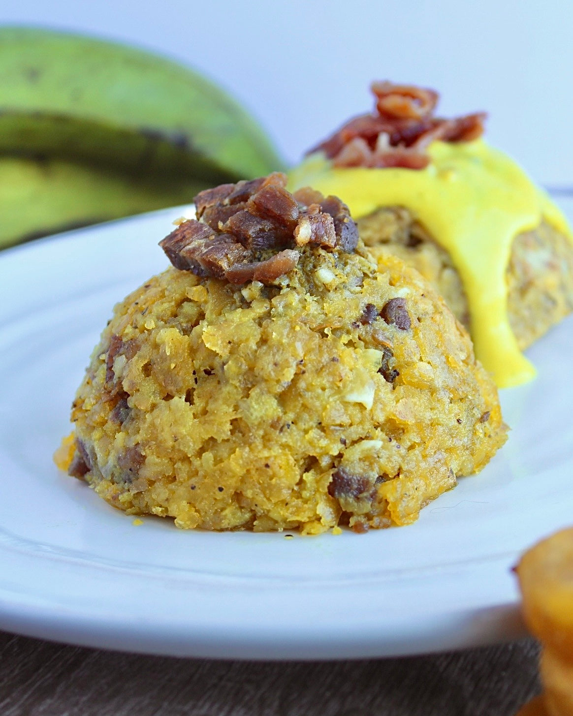 Two different types of mofongo on plate