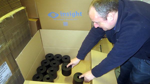 roller barrier cups being carefully packed