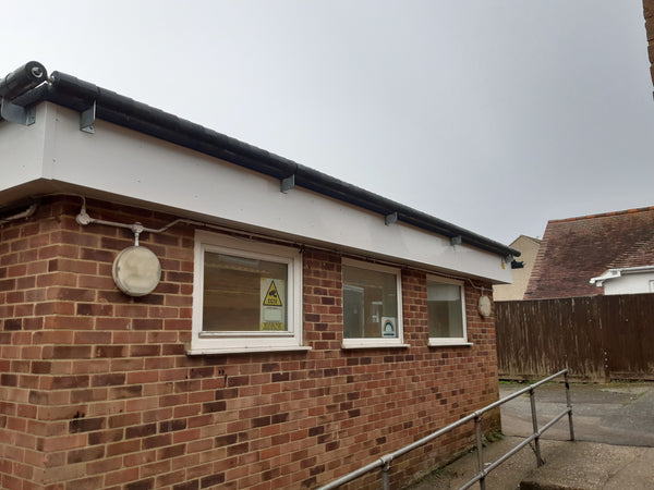 roller barrier protects childrens centre flat roof