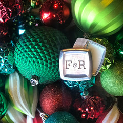 Fulton & Roark solid cologne surrounded by christmas ornaments