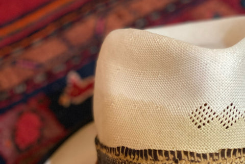 on straw hats, sweat shows up as a brownish stain at the point where the crown meets the brim