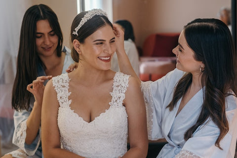 bridesmaids helping bride get ready