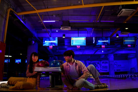 couples having fun in a bowling alley