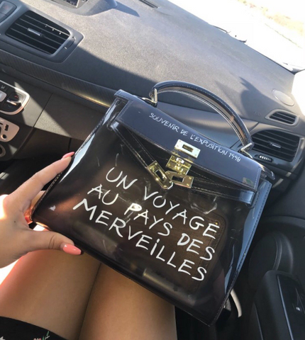 un voyage au pays des merveilles hermes bag