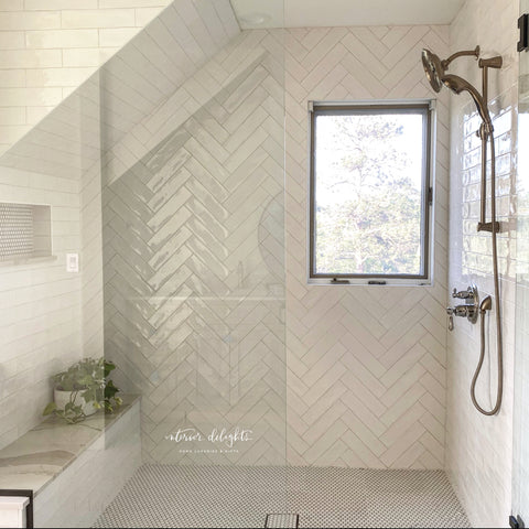 White textured subway tile with penny tile floors