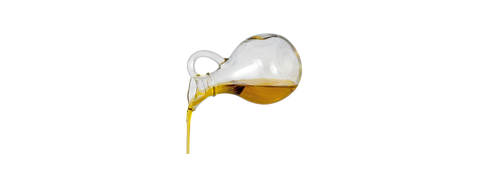 olive oil being poured out of bottle