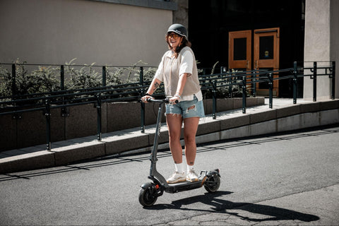 A woman on an apollo scooter