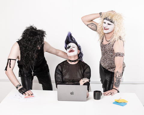 Three People in front of a laptop wearing corpse makeup