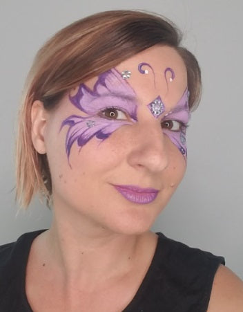 Purple Butterfly Face Paint design on Anna