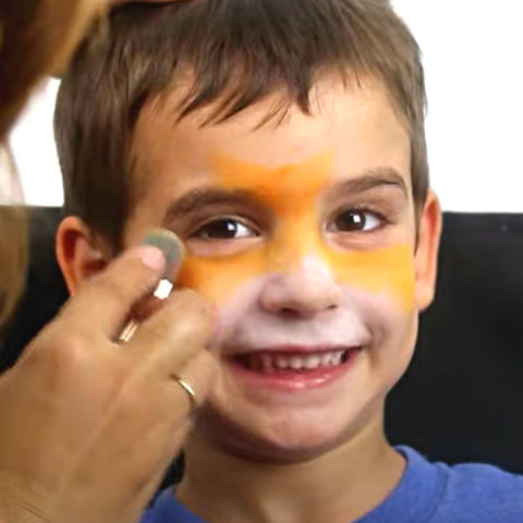 Applying Mehron INtense powders to Angelo's face