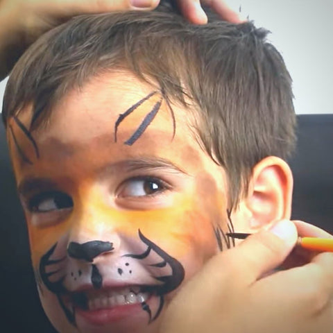 Angelo getting fur painted on his face