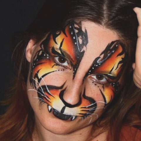 Tribal Cat face painting idea with flame colors by Face Painter Anna Wilinski