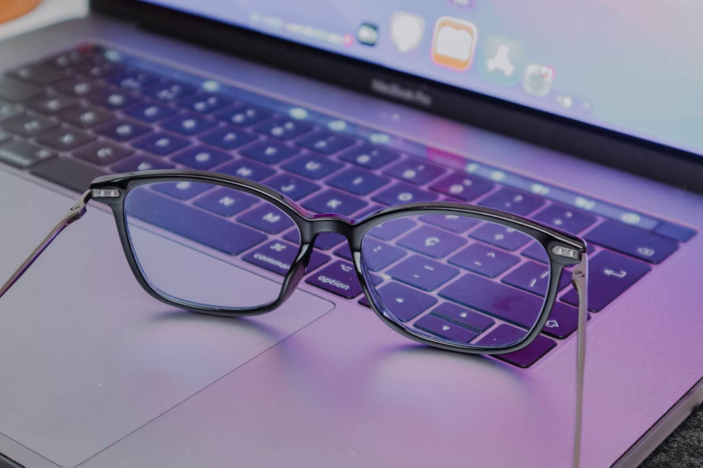 Glasses sitting on laptop keyboard