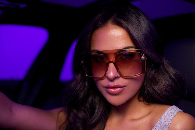 Woman wearing oversized sunglasses