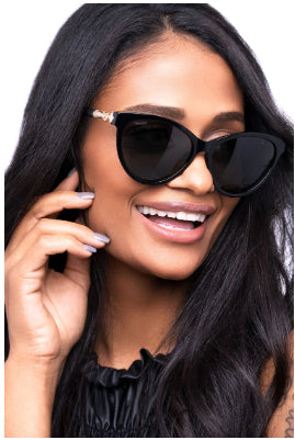 Woman wearing designer cat-eye sunglasses