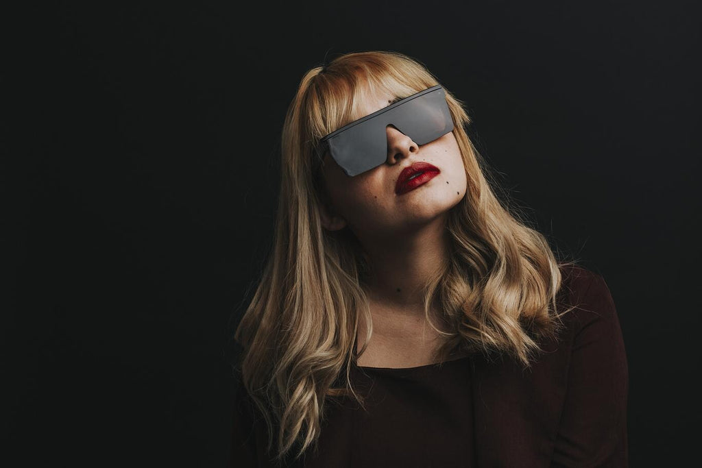 Blonde woman wearing oversized square sunglasses