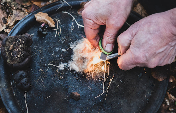 igniting tinder for a fire