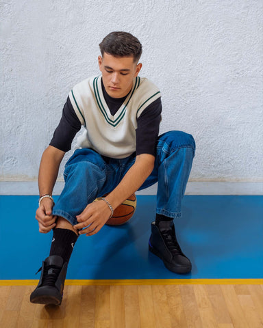 Diogo wearing custom shoes, showcasing Diverge sneakers and promoting social impact through the Imagine project.