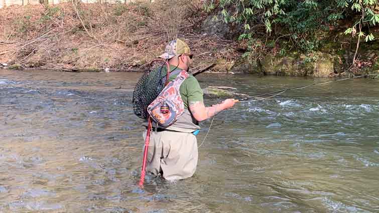 Man Fishing in Waders