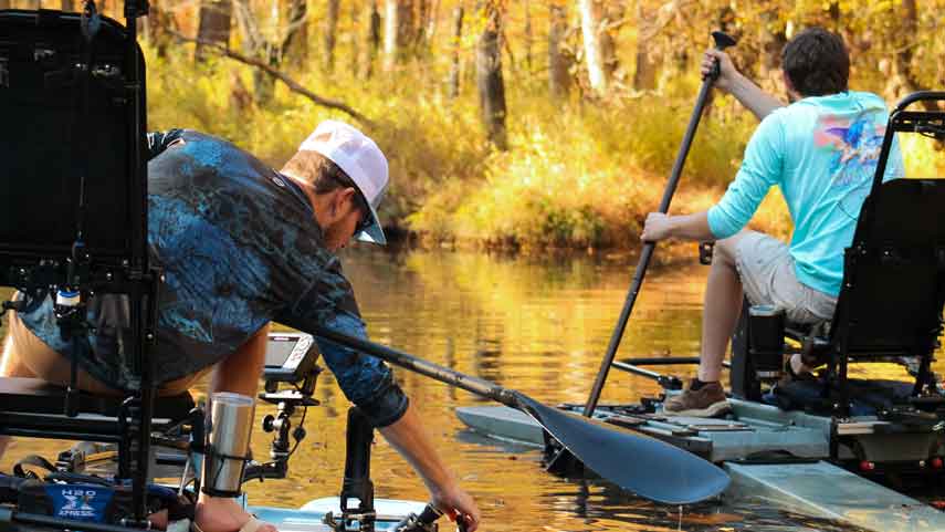 two men on sit on top kayak