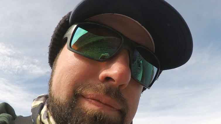 Man wearing polarized sunglasses for fly fishing