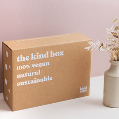 brown cardboard box with white writing on it the kind box ethical vegan and sustainable.