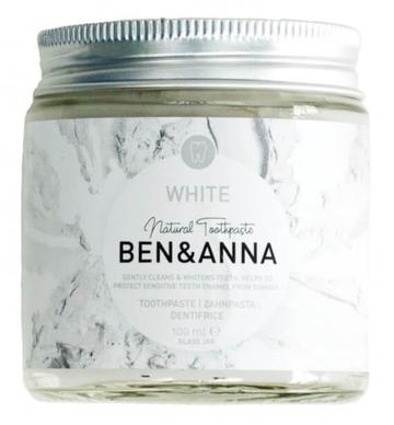 Natural whitening toothpaste in a glass jar with a metal lid by ben and anna.