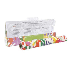 botanical vegan wax wraps on a roll next to cardboard box packaging.