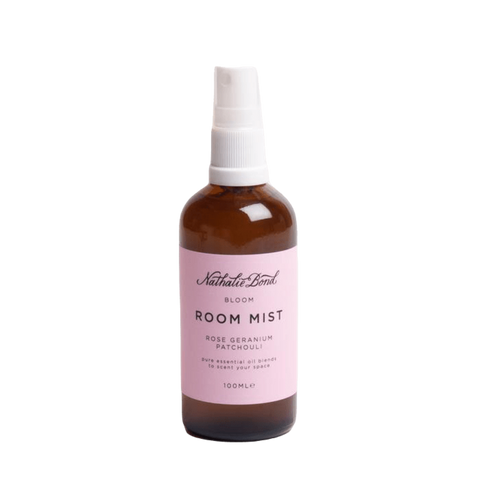 nathalie bond bloom room mist in amber glass bottle with a pink label.